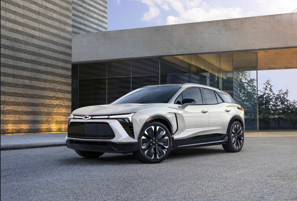 Seven-eighths view of 2024 Chevrolet Blazer EV RS in Iridescent Pearl Tricoat. Preproduction model shown. Actual production model may vary. 2024 Chevrolet Blazer EV available Spring 2023.
