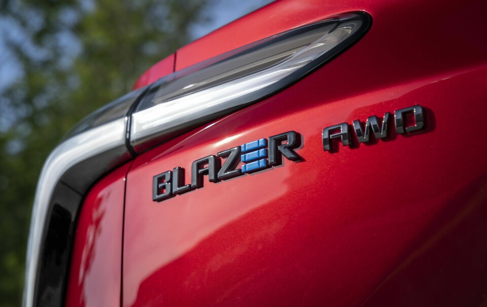 Close up of driver’s side taillight and Blazer EV badge on the 2024 Chevrolet Blazer EV SS in Radiant Red Tintcoat. Preproduction model shown. Actual production model may vary. 2024 Chevrolet Blazer EV available Spring 2023.