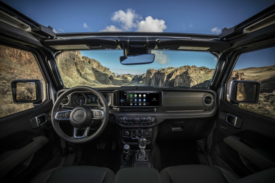 New 2024 Jeep® Wrangler High Altitude 4xe with 12-way power adjustable front seats and all-new instrument panel featuring Uconnect 5 system with best-in-class 12.3-inch touchscreen radio